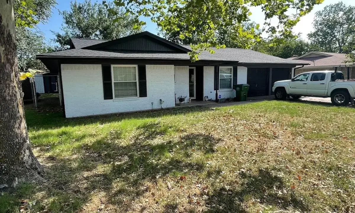 Professional roofing crew working on a residential roof in Chanhassen